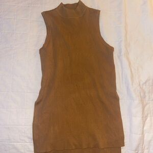 Long sleeveless mock turtleneck sweater with side slits